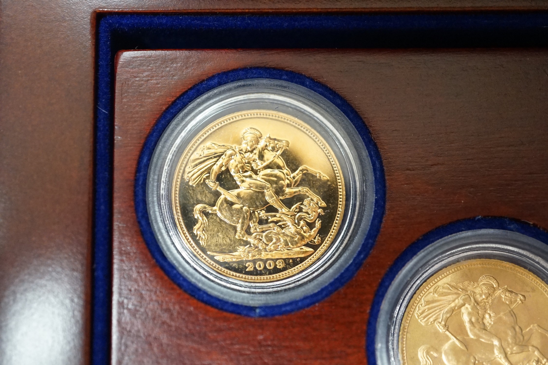 QE II coins, a triple gold sovereign set; 1959, 1974 & 2009.